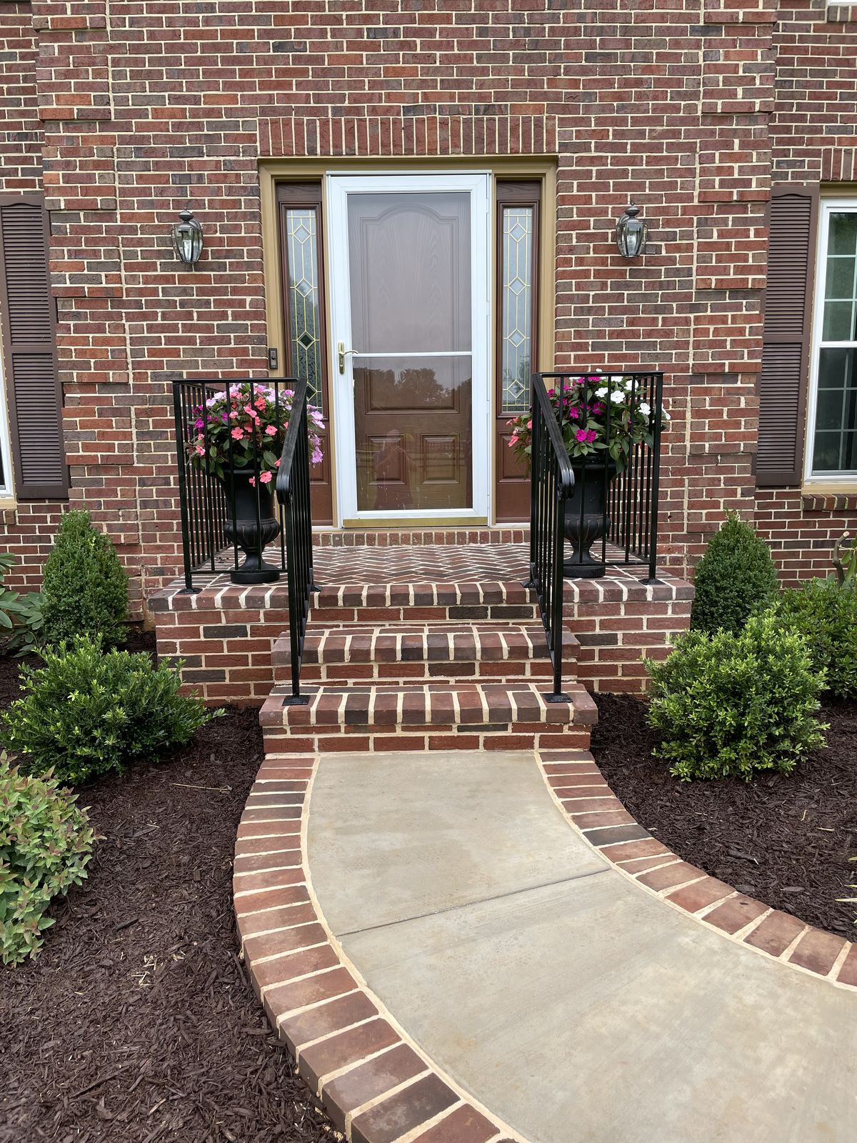 After: brick stoop with herringbone pattern