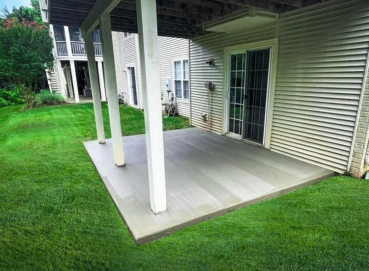Concrete patio poured under a raised deck by MG Minor Construction, concrete contractor serving Jeffersonton VA