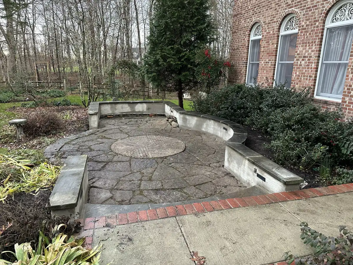 After: refurbished flagstone courtyard patio and seating wall